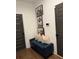 Stylish hallway boasts comfortable bench seating with plush pillows, adorned with elegant artwork, providing a functional space at 63 Aspen Way, Dallas, GA 30157