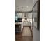 Modern kitchen with island seating, stainless appliances, and white cabinetry at 63 Aspen Way, Dallas, GA 30157