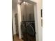 Convenient laundry room features gray cabinetry and front-loading washer and dryer at 63 Aspen Way, Dallas, GA 30157