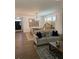 Open-concept living space featuring hardwood floors, modern furnishings, and abundant natural light at 63 Aspen Way, Dallas, GA 30157