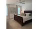 Spacious main bedroom with a ceiling fan, large windows and comfortable looking bed at 63 Aspen Way, Dallas, GA 30157