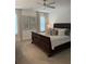 Spacious main bedroom with a ceiling fan, large windows and comfortable looking bed at 63 Aspen Way, Dallas, GA 30157