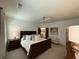 Main bedroom featuring a ceiling fan, sitting area, and bathroom access at 63 Aspen Way, Dallas, GA 30157