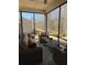 Relaxing screened patio with wicker furniture and a ceiling fan at 63 Aspen Way, Dallas, GA 30157