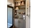 Built in shelving offers storage along with an elegant display area near the front door at 63 Aspen Way, Dallas, GA 30157