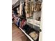 Organized walk-in closet with hanging rods, drawers, and pull out hampers, maximizing storage and accessibility in a stylish design at 63 Aspen Way, Dallas, GA 30157