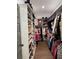 Spacious walk-in closet with custom shelving and hanging racks providing ample storage space for shoes, clothes, and accessories at 63 Aspen Way, Dallas, GA 30157
