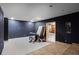 Unfinished basement features bare walls, a mattress, table, and doorway at 6710 Grayland Dr, Douglasville, GA 30135