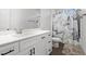 Stylish bathroom with quartz countertops, modern fixtures, and a decorative shower curtain at 6710 Grayland Dr, Douglasville, GA 30135