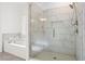 Beautiful bathroom featuring a large tiled shower with glass door and a separate soaking tub at 6710 Grayland Dr, Douglasville, GA 30135