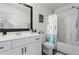 Well-lit bathroom with a vanity, modern fixtures, and a shower-tub combo at 6710 Grayland Dr, Douglasville, GA 30135