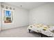 Cozy bedroom with natural light, neutral carpet, and a playful bedspread for a -friendly space at 6710 Grayland Dr, Douglasville, GA 30135