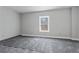 Bedroom showing gray carpet and walls, awaiting personal touches to transform it into a cozy space at 6710 Grayland Dr, Douglasville, GA 30135