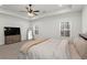 Spacious main bedroom boasts trey ceilings, plush carpeting, and dual windows offering ample natural light at 6710 Grayland Dr, Douglasville, GA 30135