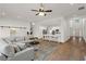 Open-concept living room features barn doors, and a view into the adjacent kitchen and entryway at 6710 Grayland Dr, Douglasville, GA 30135