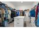 Well-organized walk-in closet with ample storage, shelving, and a central island for convenience at 6710 Grayland Dr, Douglasville, GA 30135