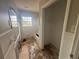Bathroom area with a tub and closet at 3488 Richmond Se Dr, Conyers, GA 30094