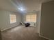 Cozy bedroom with carpet flooring and natural light from large windows at 3488 Richmond Se Dr, Conyers, GA 30094