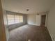A comfortable bedroom with carpet, a ceiling light, and natural lighting at 3488 Richmond Se Dr, Conyers, GA 30094