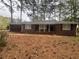 Charming brick home with a classic design and a cozy front porch at 3488 Richmond Se Dr, Conyers, GA 30094