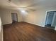 A living room with a ceiling fan and hardwood floors at 3488 Richmond Se Dr, Conyers, GA 30094