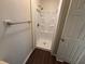 Compact bathroom featuring a new shower stall and wood-look flooring at 3839 Henry Ct, Acworth, GA 30101