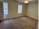 Comfortable bedroom featuring soft carpeting, natural light, and a cozy ambiance at 3839 Henry Ct, Acworth, GA 30101