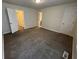 A spacious bedroom with neutral carpeting and multiple doorways for convenience at 3839 Henry Ct, Acworth, GA 30101