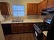 Well-lit kitchen featuring stainless steel appliances, granite countertops, and classic wood cabinetry at 3839 Henry Ct, Acworth, GA 30101