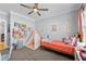 Vibrant bedroom with colorful decor, play tent, and ample space for toys and imagination at 4064 Comanche Dr, Tucker, GA 30084