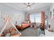 Charming bedroom with a playful teepee and colorful decor, perfect for a space at 4064 Comanche Dr, Tucker, GA 30084