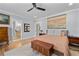 Comfortable bedroom featuring neutral walls, hardwood flooring, and stylish furnishings at 4064 Comanche Dr, Tucker, GA 30084
