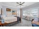 Bright bedroom with large windows, hardwood floors, and a ceiling fan at 4064 Comanche Dr, Tucker, GA 30084