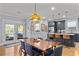 Dining area with an eye-catching light fixture and french doors leading to the outside at 4064 Comanche Dr, Tucker, GA 30084
