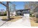 Spacious home with a long driveway, lush landscaping, and painted brick exterior, perfect for Gathering living at 4064 Comanche Dr, Tucker, GA 30084