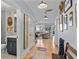 Bright hallway with hardwood floors, stylish decor, and easy access to bathroom and living spaces at 4064 Comanche Dr, Tucker, GA 30084