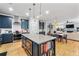Kitchen with an island with bar stools and stainless steel appliances at 4064 Comanche Dr, Tucker, GA 30084