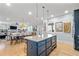 Open floor plan of a kitchen with island seating and stainless steel appliances at 4064 Comanche Dr, Tucker, GA 30084