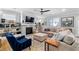Comfortable living room with fireplace, built-in shelving, and ample seating, perfect for relaxing and entertaining at 4064 Comanche Dr, Tucker, GA 30084