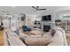 Open-concept living room with a fireplace and built-in shelving at 4064 Comanche Dr, Tucker, GA 30084