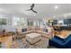 Open living area with stylish furniture, hardwood flooring, and large windows at 4064 Comanche Dr, Tucker, GA 30084