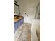 Bathroom with double sinks, custom vanity, stone floors and combined tub shower at 5760 Old Carriage Dr, Atlanta, GA 30349