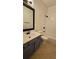 Bathroom featuring a vanity, toilet and shower-tub combo, designed for daily functionality with a tile floor at 5760 Old Carriage Dr, Atlanta, GA 30349