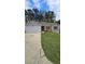 Charming single-story home with a well-maintained lawn, a combination brick and siding exterior, and an attached garage at 5760 Old Carriage Dr, Atlanta, GA 30349
