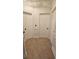 A well-lit hallway features classic doors, complemented by neutral walls and durable tiled flooring at 5760 Old Carriage Dr, Atlanta, GA 30349