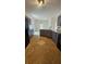 Open kitchen and dining area with custom cabinets, granite countertops and stainless steel appliances for cooking convenience at 5760 Old Carriage Dr, Atlanta, GA 30349