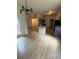 Eat-in kitchen with modern island, granite counters, stainless appliances and wood floors at 5760 Old Carriage Dr, Atlanta, GA 30349