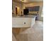 This kitchen features granite countertops, an island with a sink, and updated appliances, offering style and functionality at 5760 Old Carriage Dr, Atlanta, GA 30349