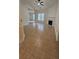 The living room features neutral walls, tile flooring, a ceiling fan, and a fireplace that brings warmth to the space at 5760 Old Carriage Dr, Atlanta, GA 30349