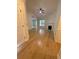 Bright open-concept living room featuring wood floors, crown molding, and a cozy fireplace at 5760 Old Carriage Dr, Atlanta, GA 30349